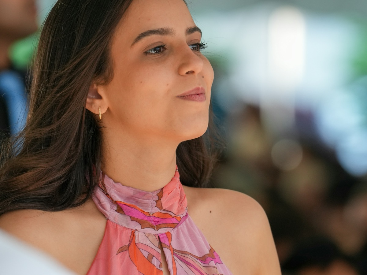 A creator at an event, looking out at the crowd